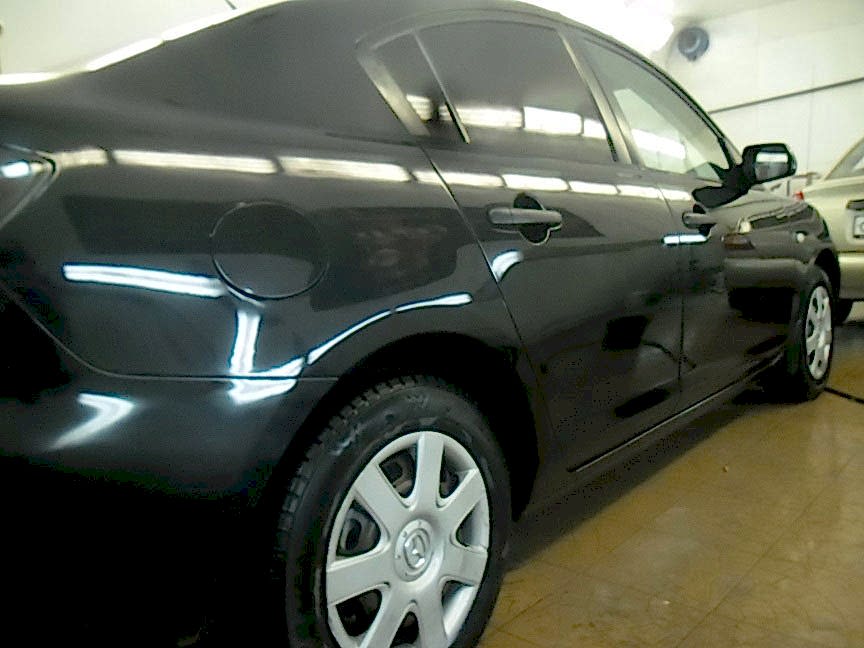 Mazda после ремонта правой части автомобиля.