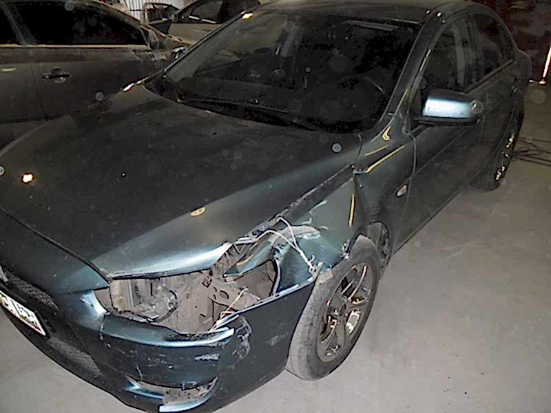 Mitsubishi Lancer Повреждение передней части автомобиля.